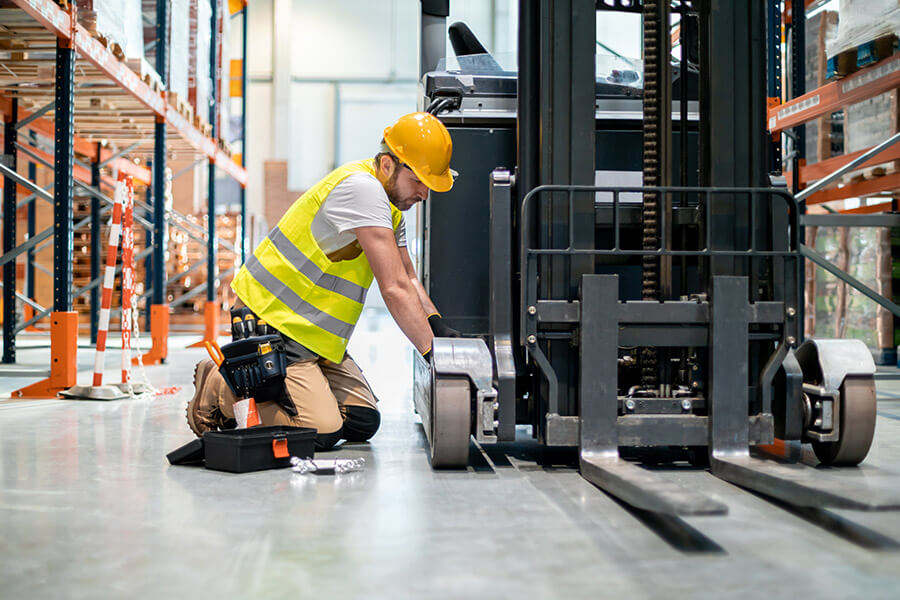 Forklift dealer mechanic at work